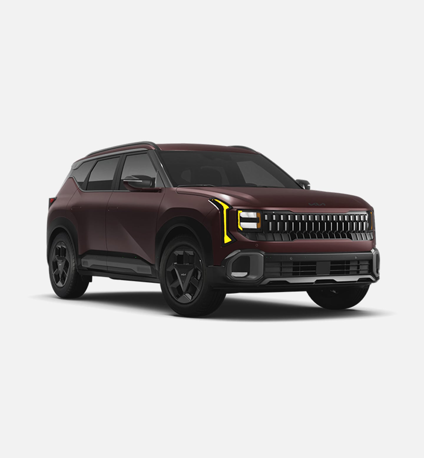A 2027 Kia Seltos is shown from the front at a slight angle, featuring sharp body lines, black wheels, and distinctive LED headlights. The Kia badge and grille are prominent, emphasizing the SUV’s bold, modern design.